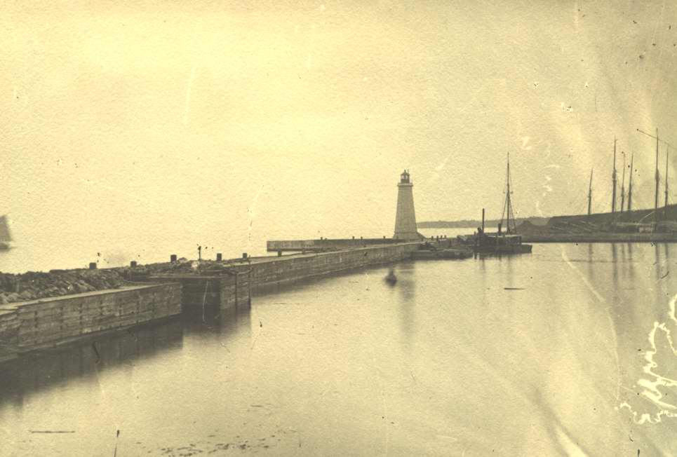 photograph of harbor, lighthou
