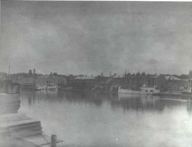 photograph of river, dock, boa