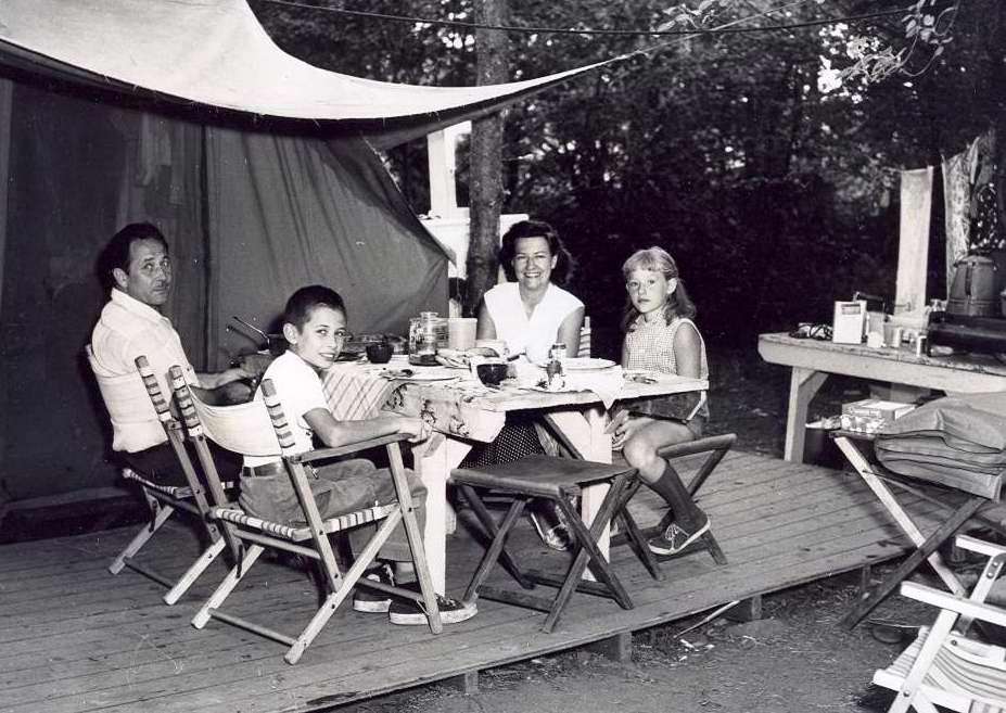 Campers eating at picnic table