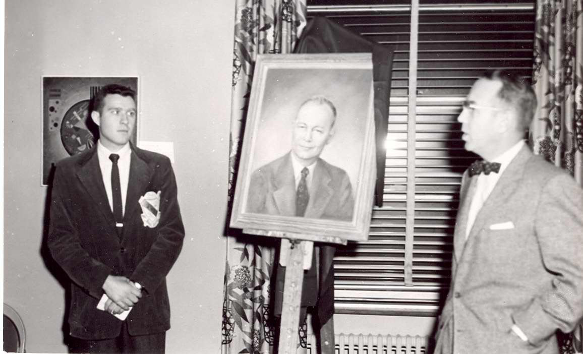 Dr. Foster S. Brown with portrait of Dr. Gabel