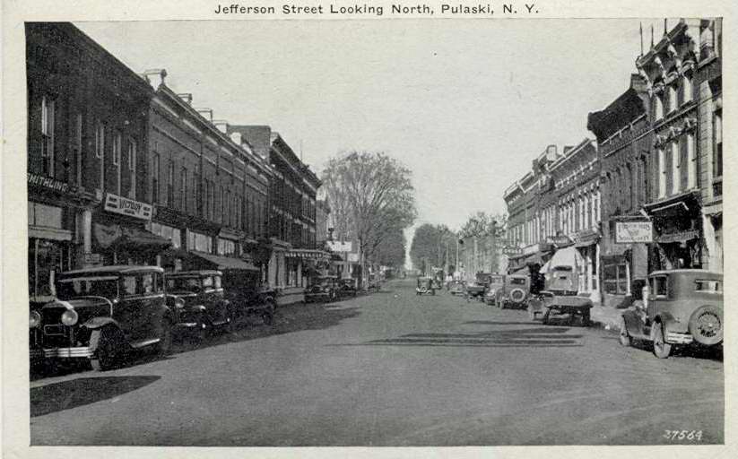 Black & white postcard with caption, "Jefferson Street Looking North, Pulaski, N.Y." - Page 1