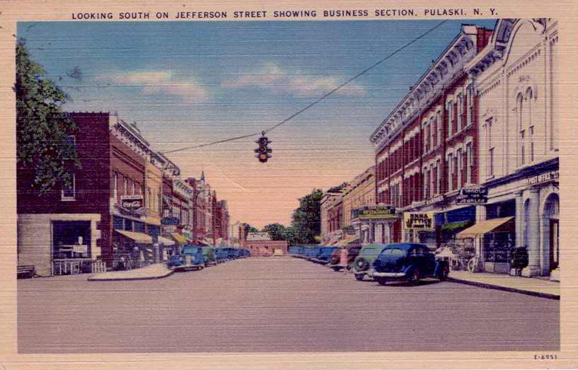 Color postcard with caption, "Looking South on Jefferson Street Showing Business Section, Pulaski, N.Y."  Handwritten note on back.  Stamped with Lacona, N.Y. postmark. - Page 1