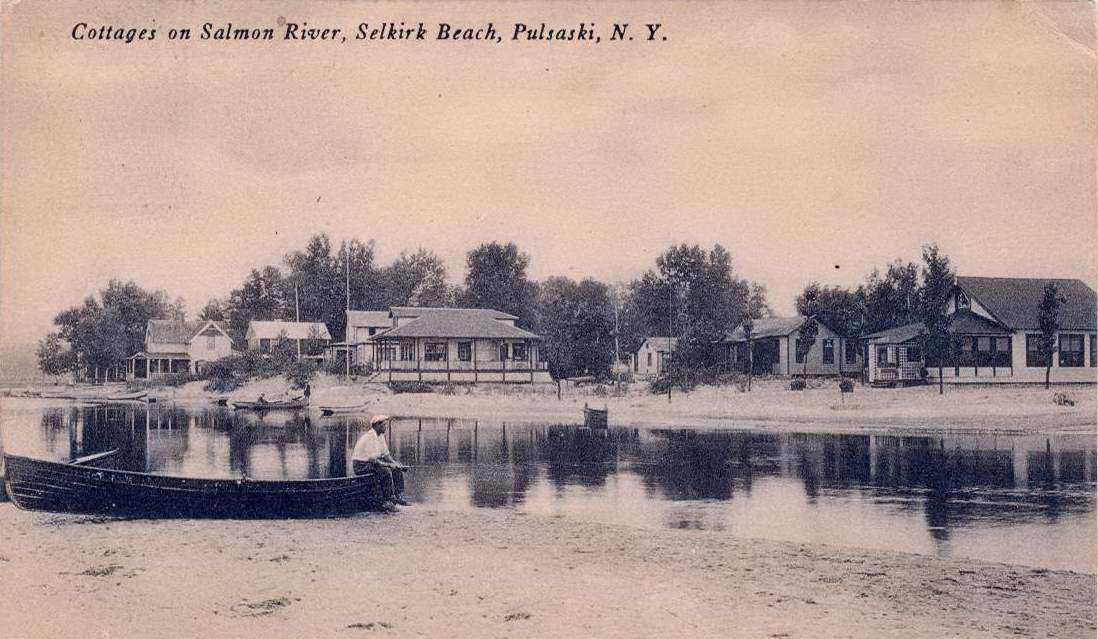 Black & white postcard with caption, "Cottages on Salmon River, Selkirk Beach, Pulaski, N.Y."  Handwritten message on back.  Stamped with Pulaski postmark. - Page 1