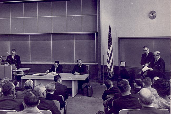 Dr. James E. Perdue - a.  Dr. James Perdue, seated, 2nd from left / unidentified students